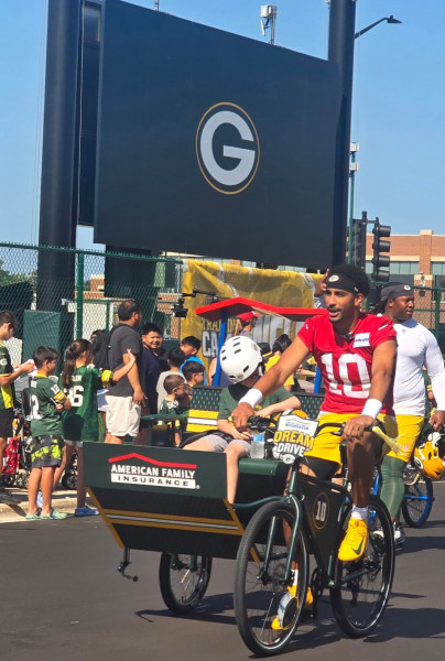 Packers quarterback and American Family brand ambassador Jordan Love with former American Family Children's hospital patient
