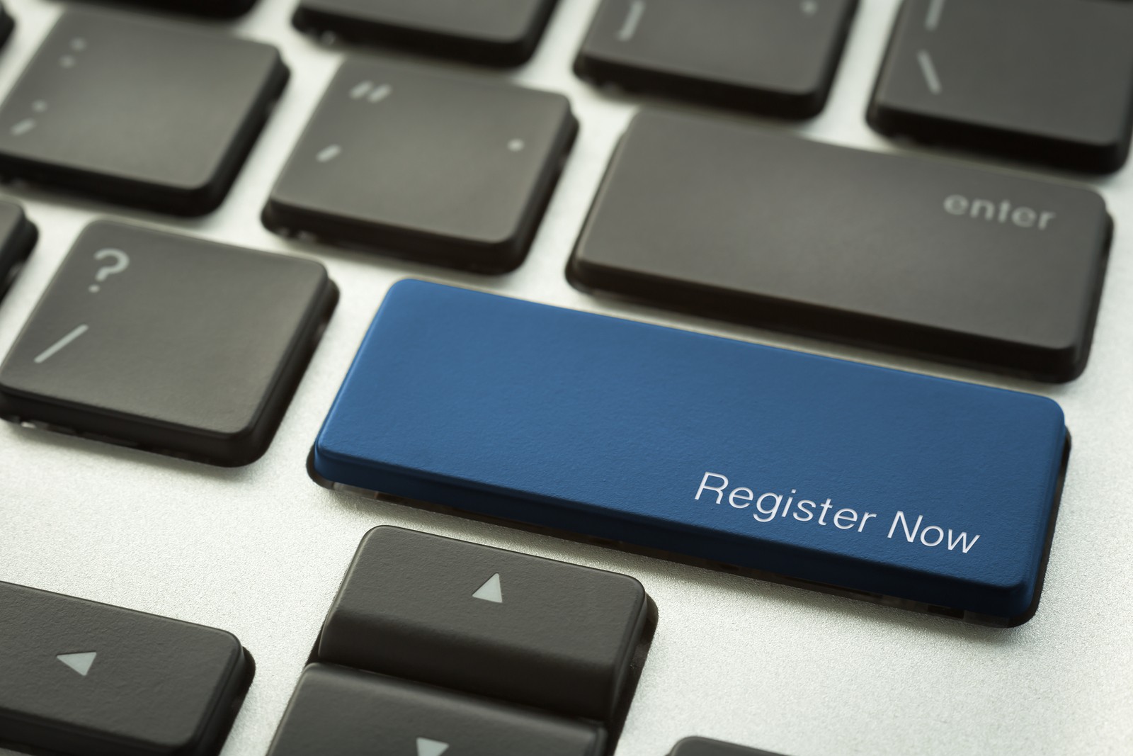 Laptop Keyboard With Typographic Register Now Button