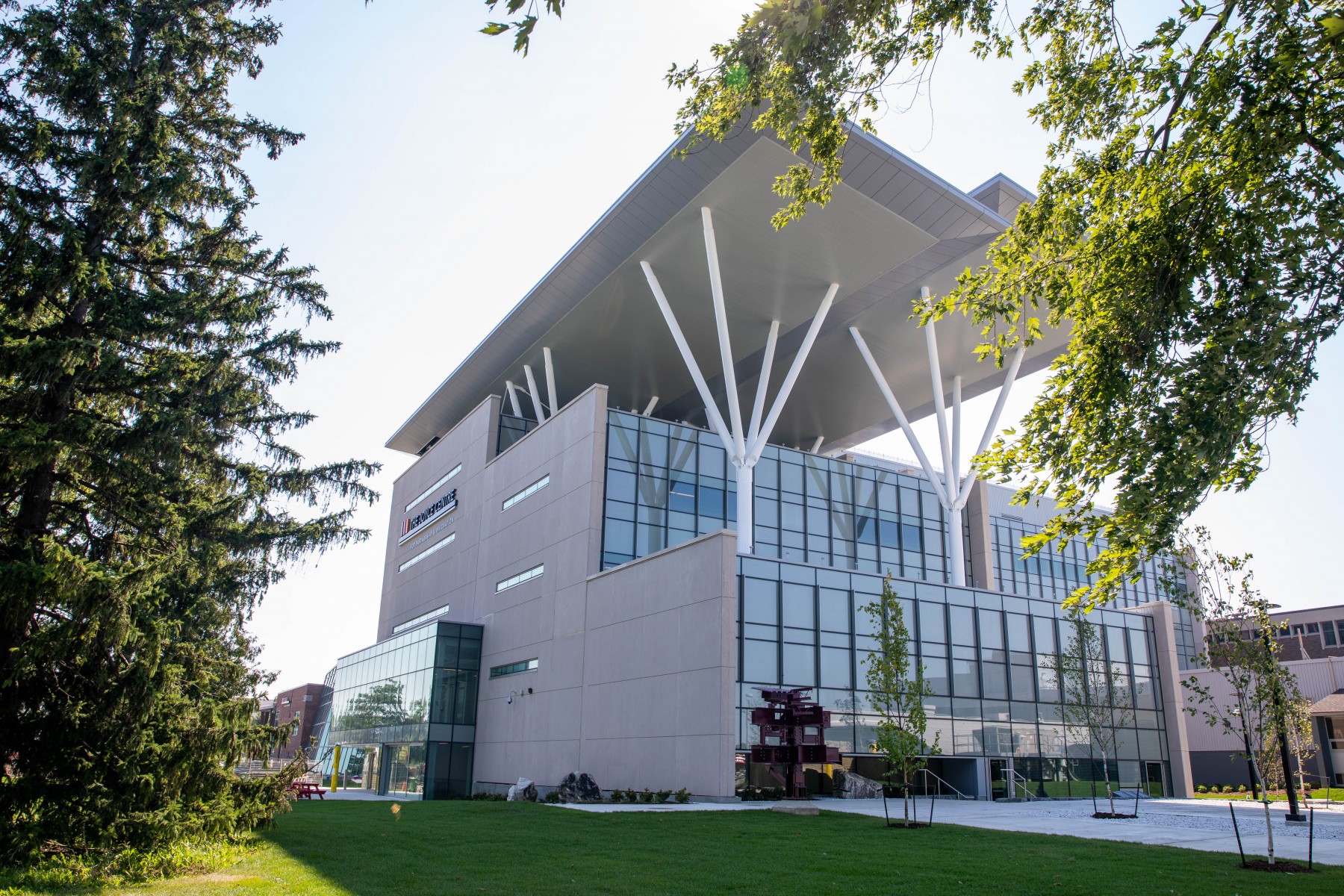 The Joyce Centre building, framed by tree branches