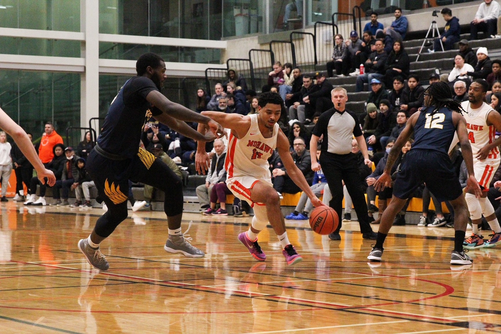 basketball player running up the court