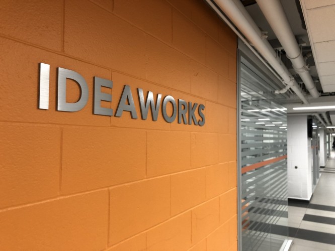 ideaworks department sign on a hallway wall