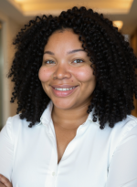 Headshot of a smiling woman in business casual clothes