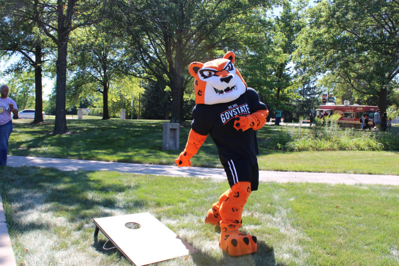 Governors State University mascot Jax the Jaguar playing bean bags