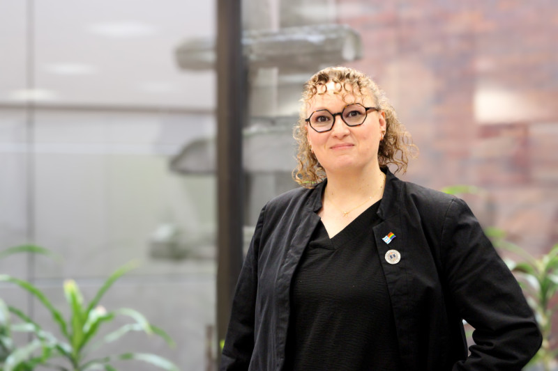Portrait photo of a woman wearing a black shirt and blazer