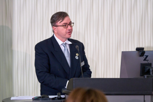 Governors State University Honors College dean speaking at a podium for honors pining ceremony