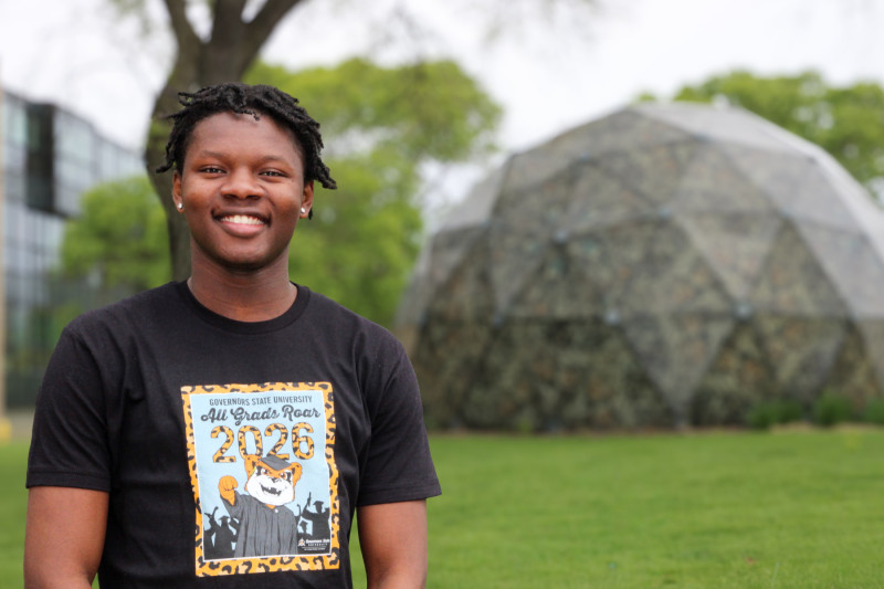 Portrait photo of a smiling man wearing a Governors State University shirt