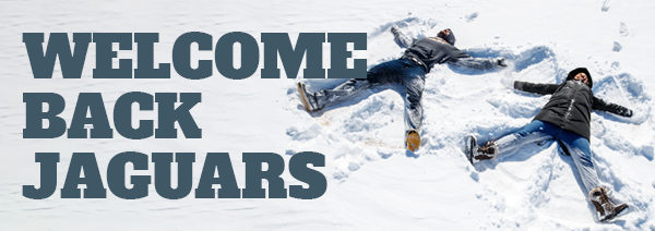 Two students making snow angels in snow with text that says Welcome Back Jaguars