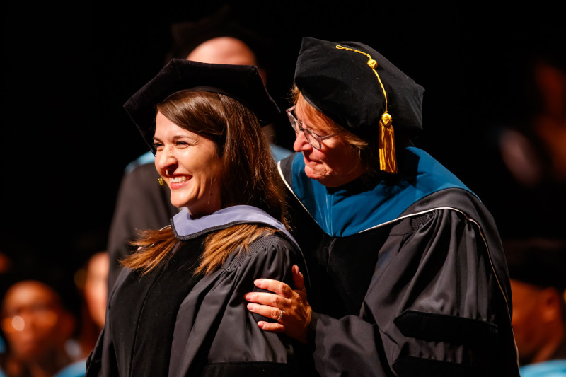 Jillian Rancatore in doctoral regalia at Governors State University Doctoral Hooding Ceremony