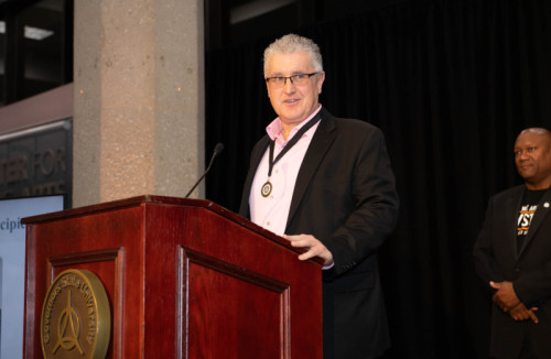 A man speaking at a podium