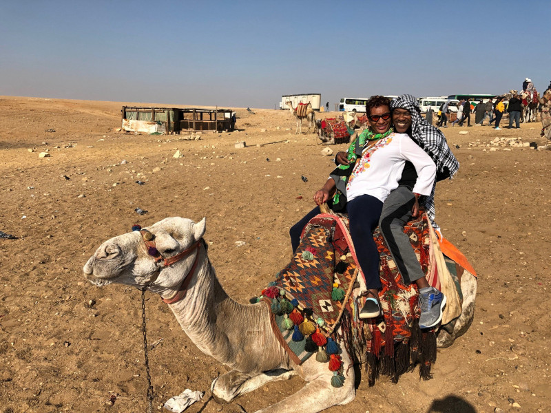 Zion and Dennis on a camel in Egypt