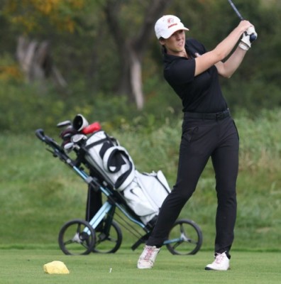 Nicole Brusich golfing on the green for GSU