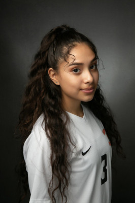 A headshot of a smiling woman wearing a Governors State University soccer jersey