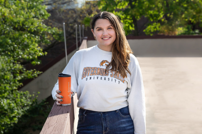 A Governors State University student wearing a GovState shirt