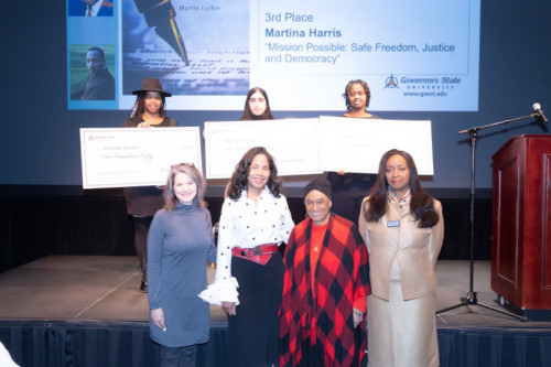 Governors State University faculty and leadership with student essay contest winners