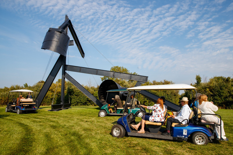 People taking guided golf carts tours at the Nathan Manilow Sculpture Park at Governors State University