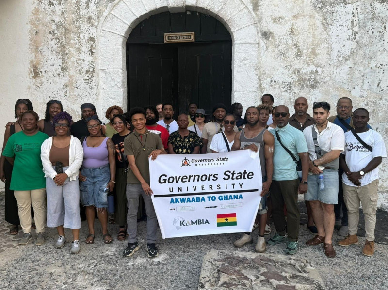 Group standing in front of Ghana's door of no return