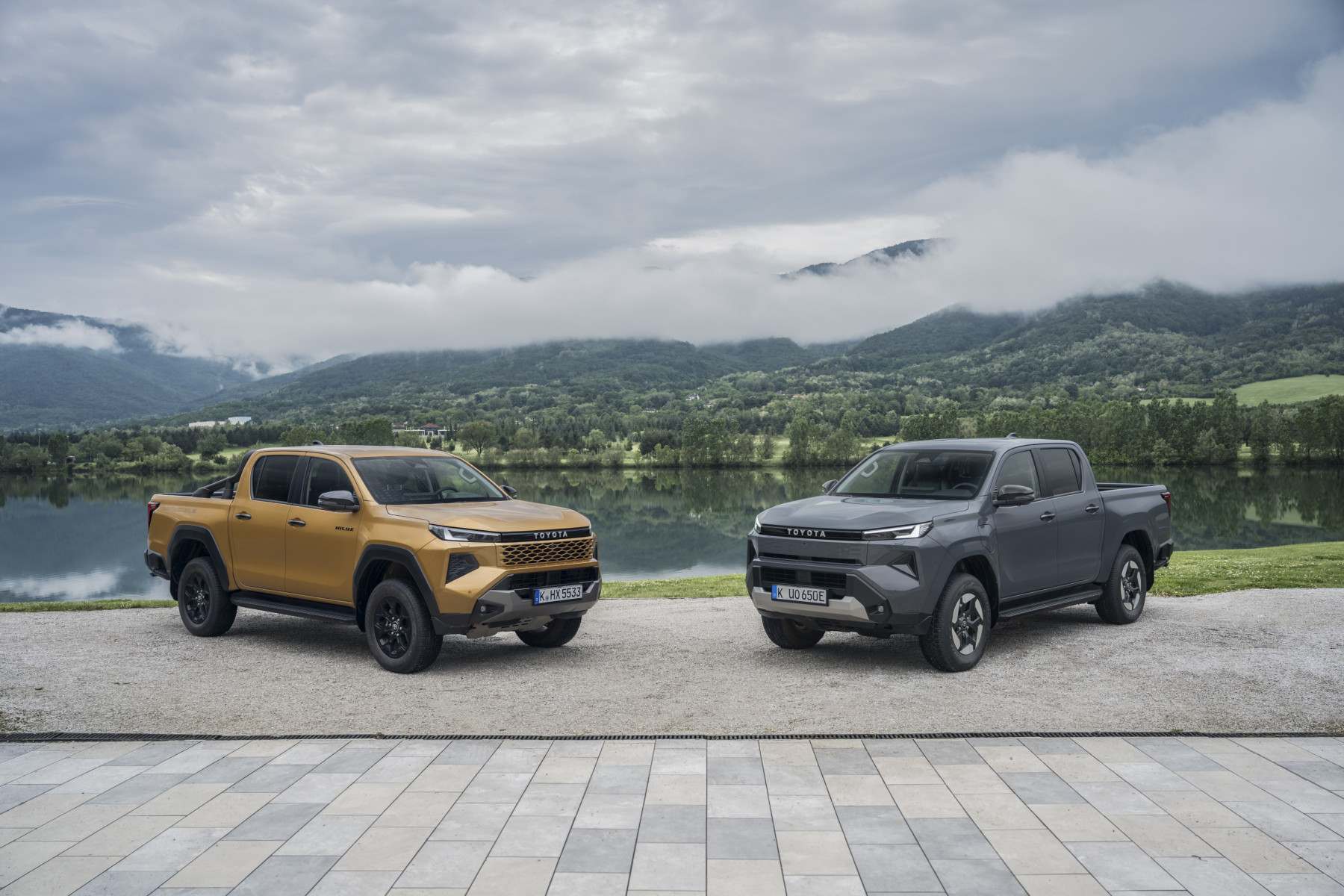 Official Toyota image showing the 2026 Hilux BEV beside the Hilux Hybrid 48V