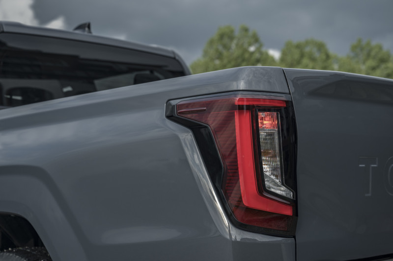 Official Toyota detail image of the 2026 Hilux BEV rear bed and tail lamp
