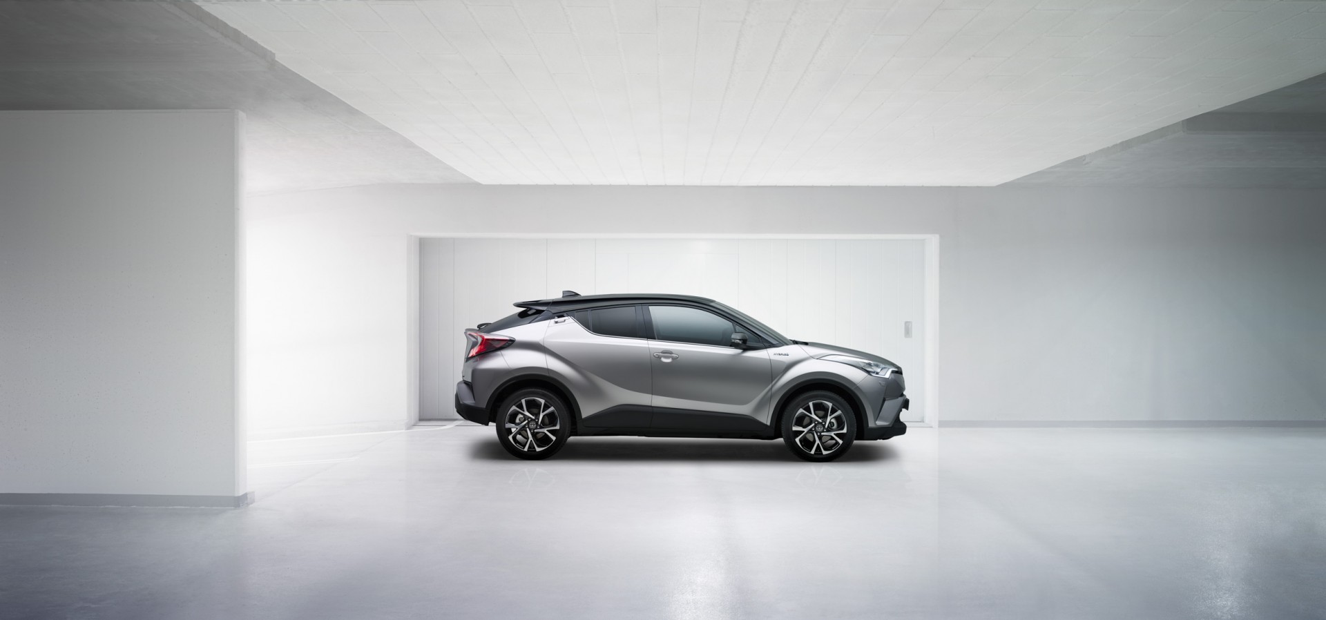Toyota C-HR in silver, side profile view