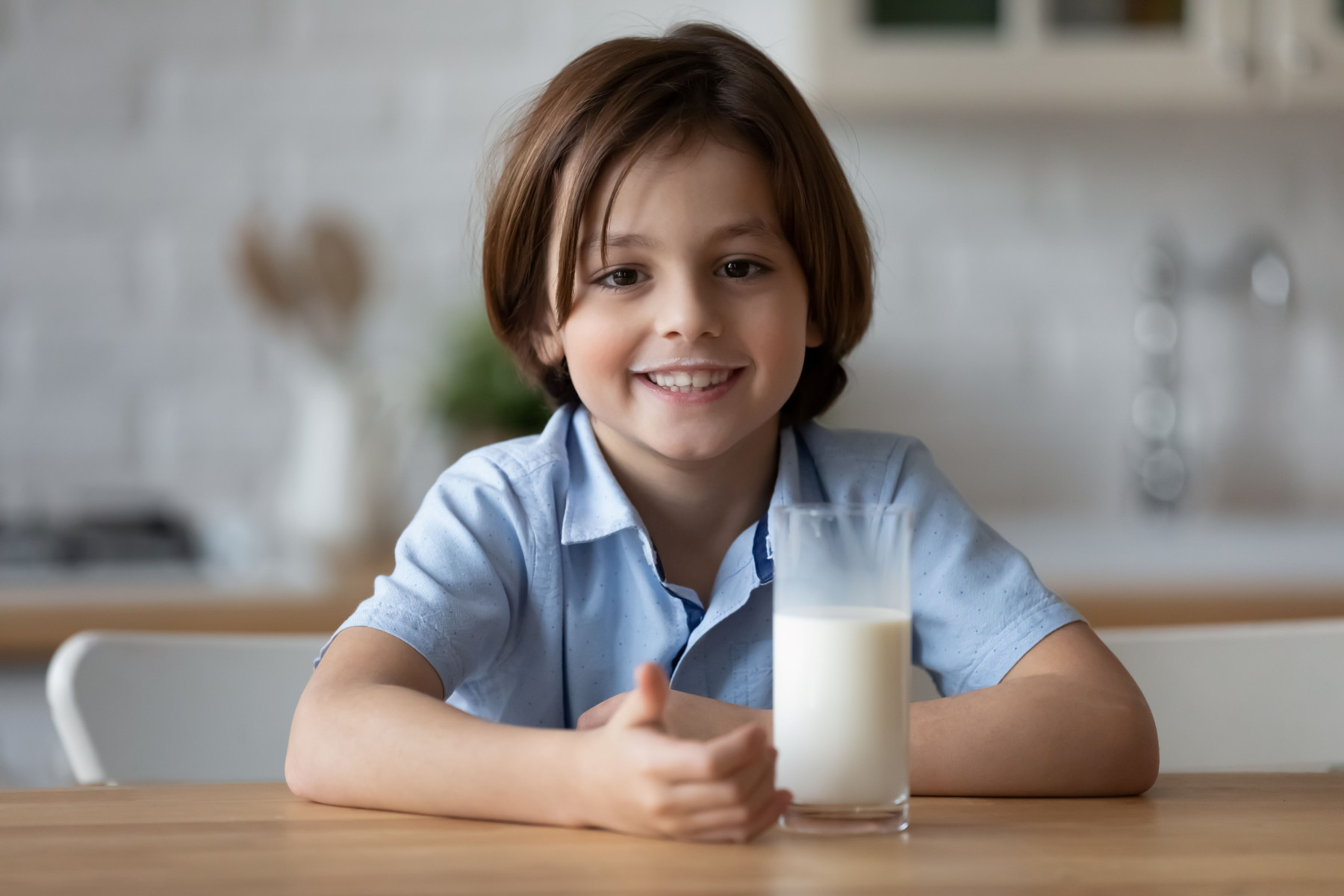 young boy drinking milk
