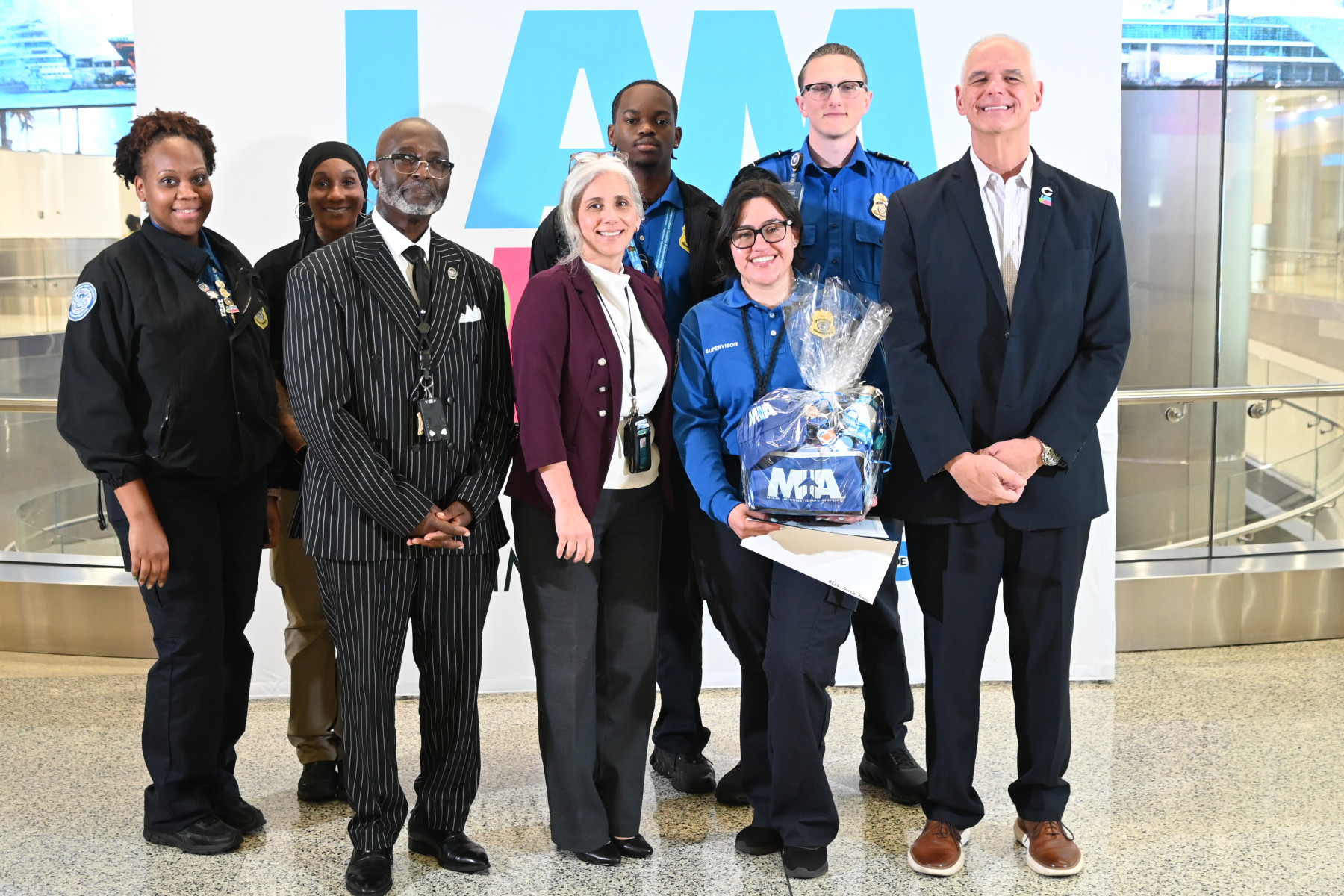 August 2026 Employee of the Month:  TSA Officer assists mom and young child who lost their travel documents