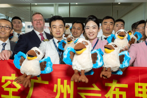 cabin crew with Brisbane Airport CEO Gert-Jan de Graaff