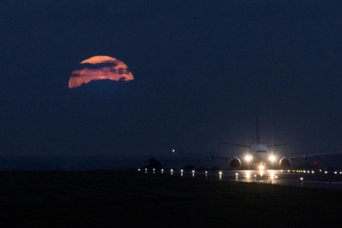 Aircraft on East Midlands Airport runway at night