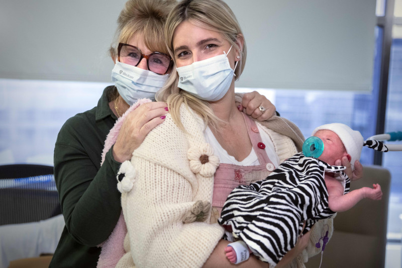 Sonya Young (center) with her mother and baby.