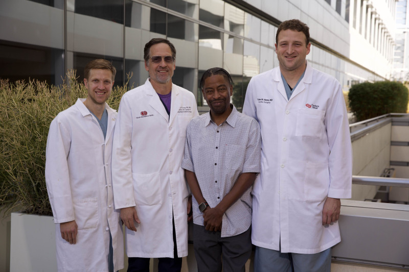 From left to right, Justin Steggerda, Nicholas Nissen, MD, Valance Sams, Sr., and Tyler Gunn, MD reunite seven months after Sams' surgery.