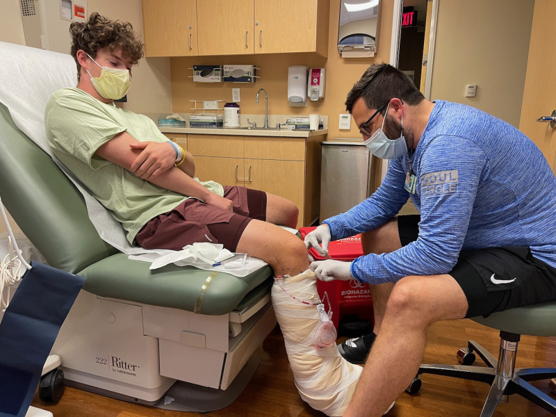 Riley Mulholland (left) is examined by Mitch Seruya, MD, after surgery. Photo courtesy of Jennifer Mulholland.