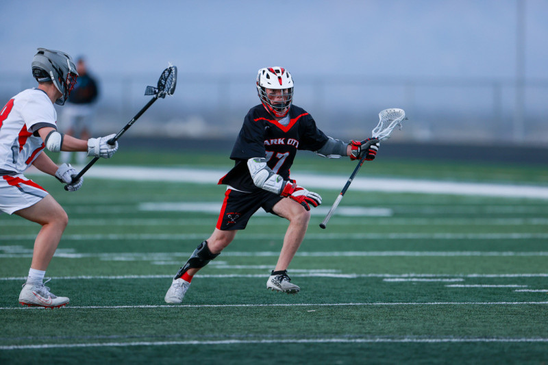 Riley Mulholland (right) playing lacrosse. Photo courtesy of Ben Anderson.