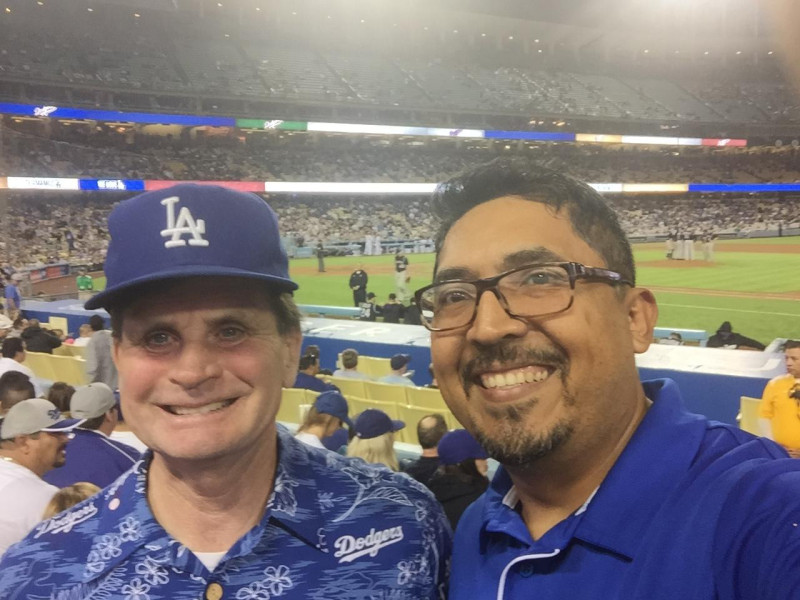 John Graham, MD, (left) with Pedro Sanchez, MD, at a Los Angeles Dodgers game. Photo courtesy of Pedro Sanchez.