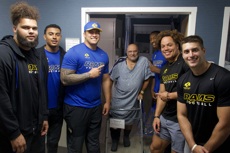 Rams players visit with patient Johnny Sebastian Salo at Cedars-Sinai Marina Hospital. Photo by Cedars-Sinai.