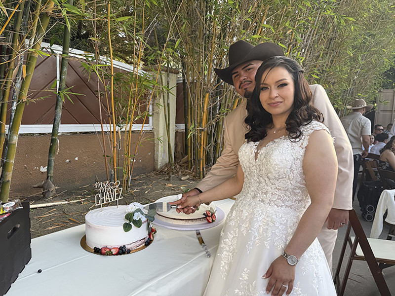 Ariana Pulido (right) and Jeffrey Chavez cut the cake at their wedding. Photo courtesy of Ariana Pulido.