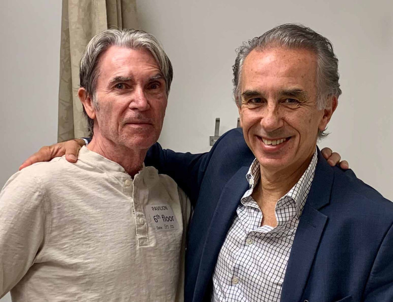 Rick Graham, at left, has Parkinson’s disease and stays in closer touch with his physician, Michele Tagliati, MD, via the Kneu Health app. Photo by Cedars-Sinai.