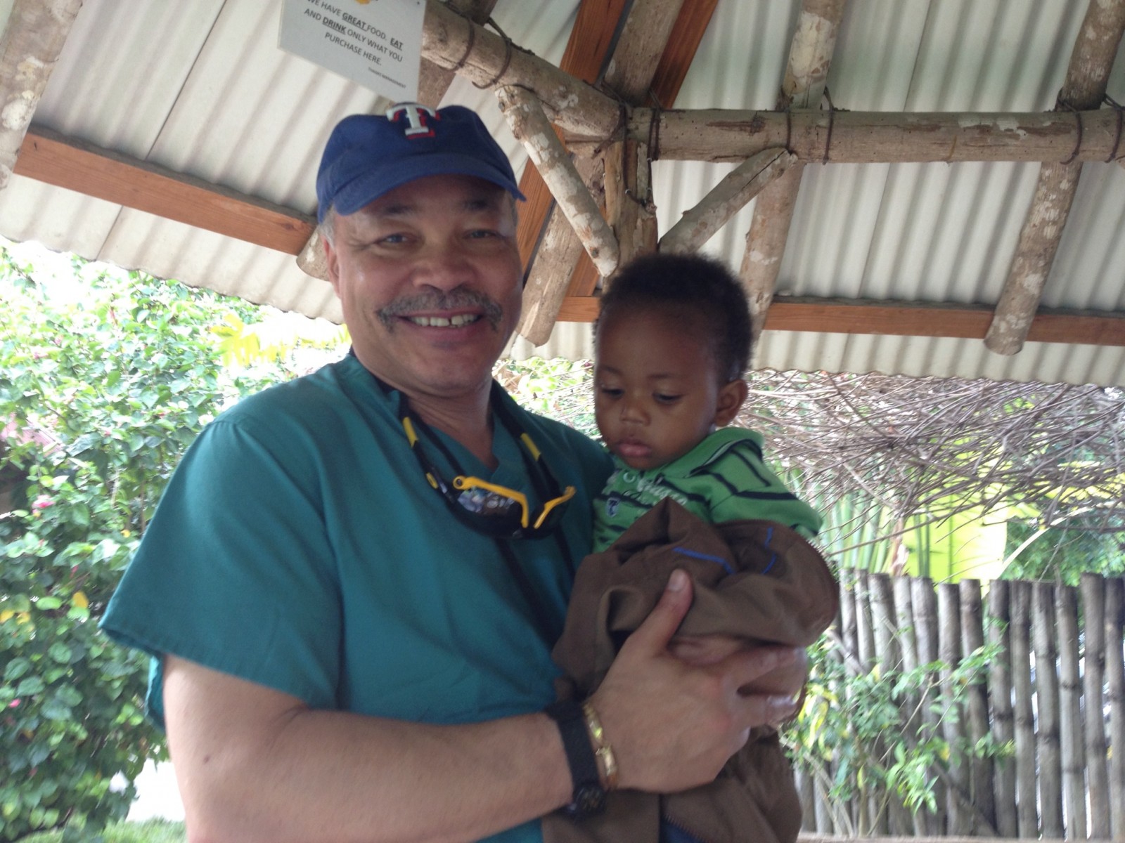 Dr. Stoute with a Patient in Jamaica