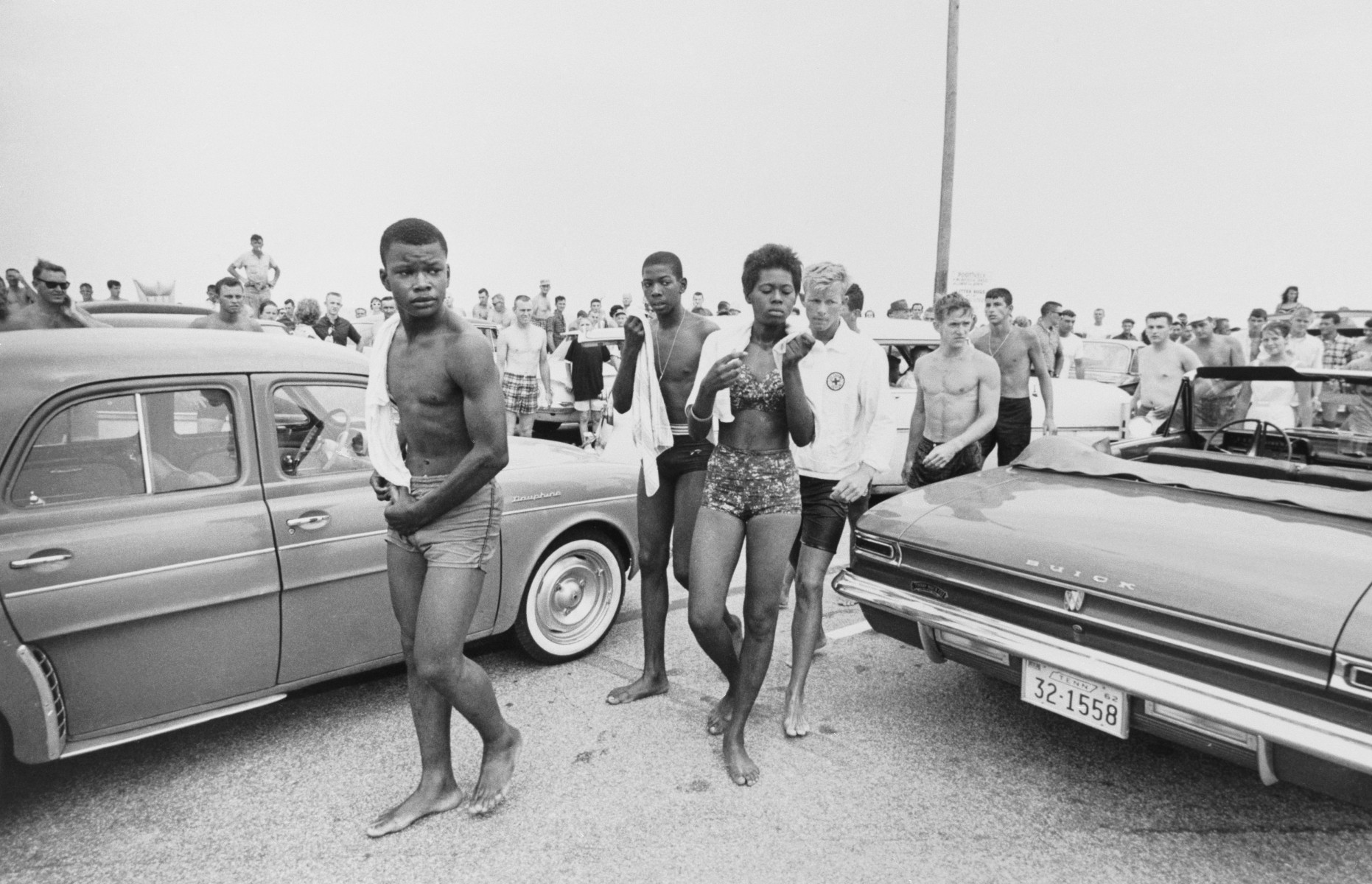A jeering crowd follows three Black youths staging a 'wade-in' to integrate Savannah Beach, Georgia, July 14, 1963. The trio were arrested by responding police, and photographers on the scene were also subjected to verbal and physical abuse. (Photo by Bettman/Getty Images)