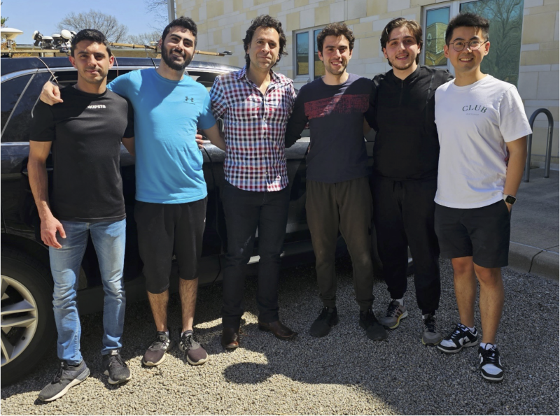 The team against the experiment vehicle. 
