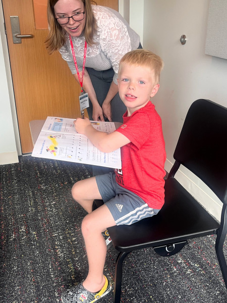 A Community Music School student learns how to read music.