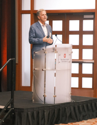 Scott Parazynski stands at the podium. Credit: The Ohio State University.