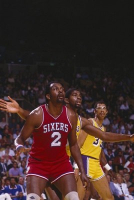 Moses Malone looks for a pass at the Great Western Forum in 1983. (Getty Images)