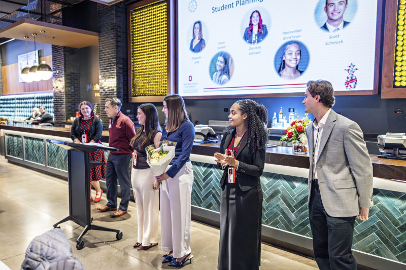 Incoming EHE Interim Dean Erik Porfeli (second from left) recognized planning committee members and volunteers.