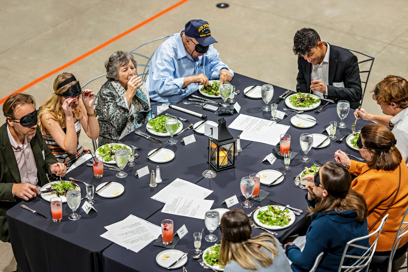 Some attendees wore sleep masks to simulate the experience of dining with impaired vision.
