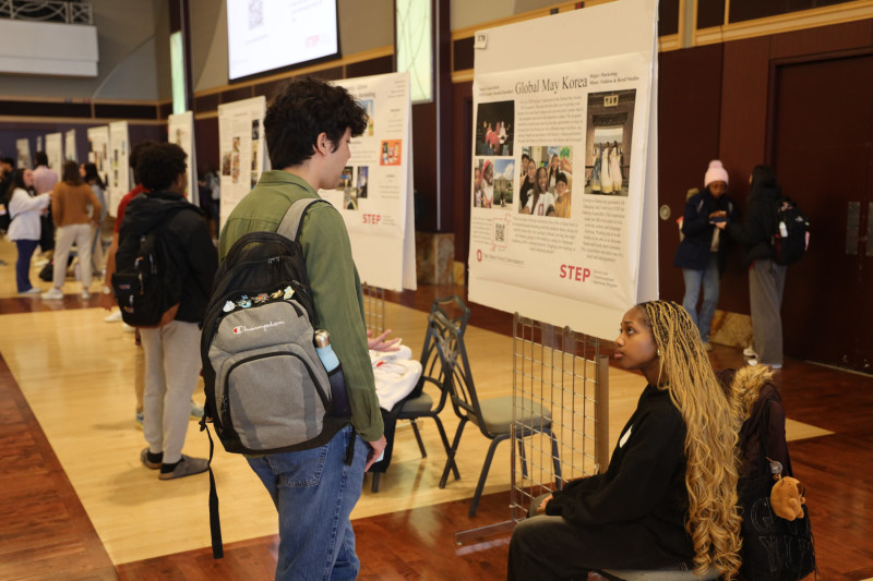 Carine Adorh (right) speaks about her experience studying abroad  in South Korea.