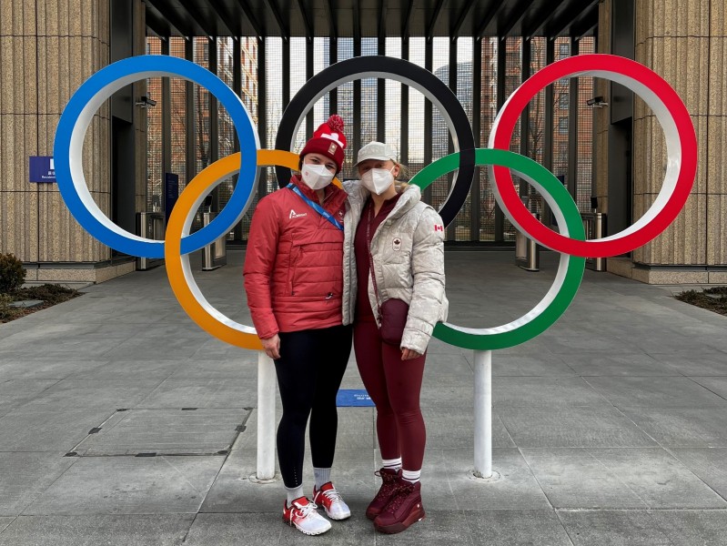 Andrea Braendli and Ohio State teammate, and Team Canada player, Emma Maltais in Beijing