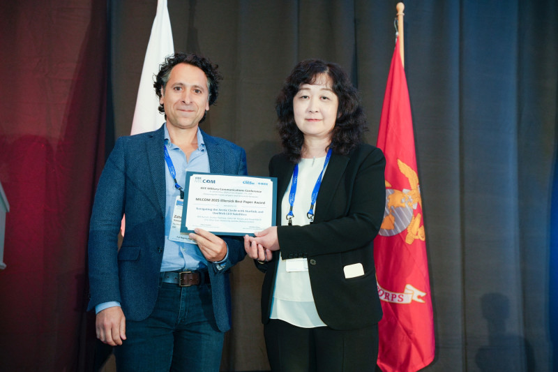 Zak Kassas accepting the 2025 Ellersick Best Paper Award.