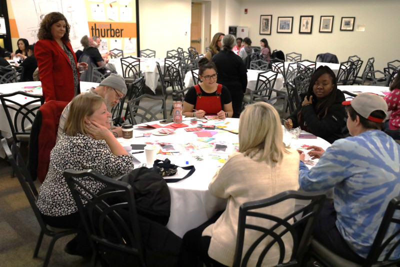 Cheryl Lyons (standing left),  Student Life Disability Services director, said handmade cards can lift recipients' spirits.