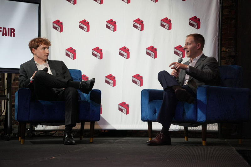 Jack Swartey (left) moderating a fireside chat with Max Brickman (right)