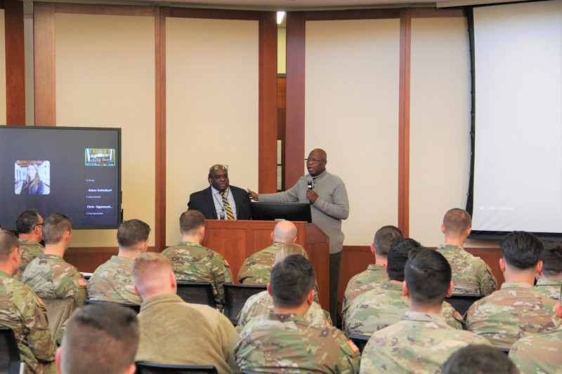 CAS Assistant Director Jacien Carr and Director Ousman Murzik Kobo address the U.S. Army Reserve members.