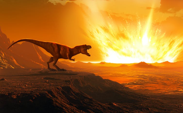 A dinosaur watches an asteroid strike the Earth.
